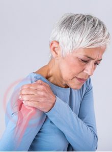 Senior woman with shoulder pain.