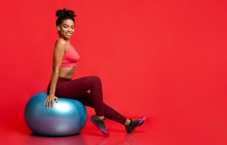 Woman Sitting on Exercise Ball