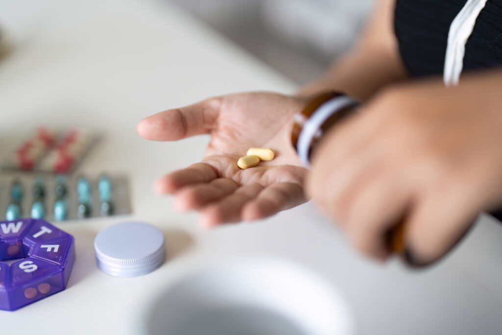 woman taking health supplements